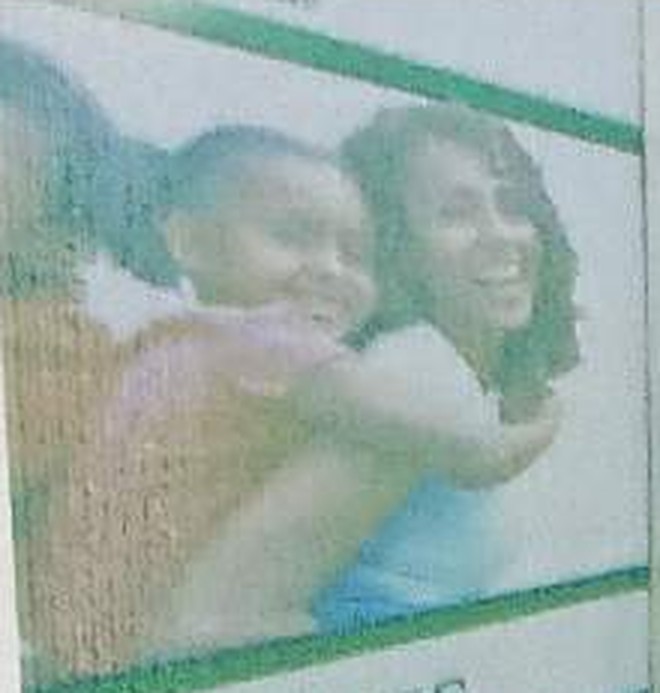 A mother and child smiling
